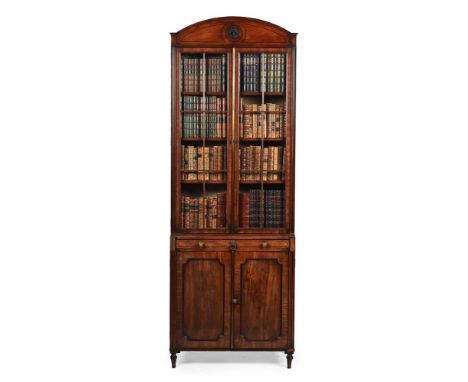 A GEORGE IV MAHOGANY BOOKCASE CABINET CIRCA 1820 The shallow secretaire drawer with interior fittings 125cm high, 80cm wide, 