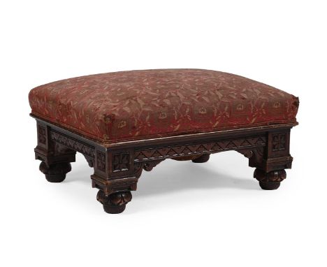 A LARGE VICTORIAN CARVED OAK AND UPHOLSTERED STOOL  BY HOWARD & SONS, CIRCA 1880 The underside with an enamel label: 'HOWARD 