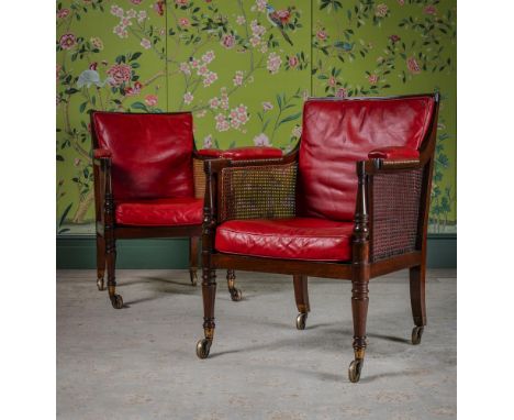 A FINE PAIR OF REGENCY MAHOGANY LIBRARY BERGERES ATTRIBUTED TO GILLOWS, CIRCA 1815 All legs with brass spoked casters, with s
