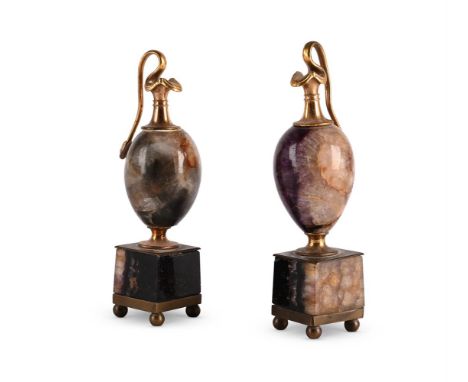 A NEAR PAIR OF ORMOLU MOUNTED BLUE JOHN AND FLUORSPAR EWERS  PROBABLY FRENCH, 19TH CENTURY  17cm high and 16.5cm high   Condi