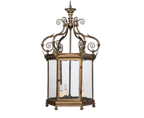 A LARGE GILT METAL FRAMED HALL LANTERN     LATE 19TH CENTURY  With anthemion and  scrollwork metalwork decoration around the 