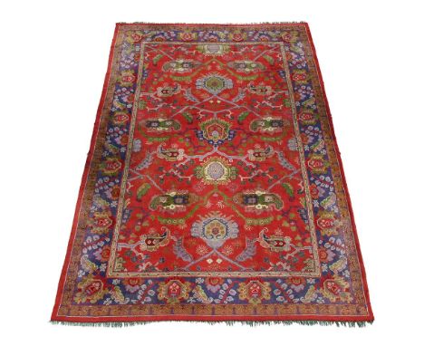 A LARGE DONEGAL CARPET  ATTRIBUTED TO GAVIN MORTON & G.K. ROBERTSON, CIRCA 1900 approximately 600 x 417cm  Condition Report: 