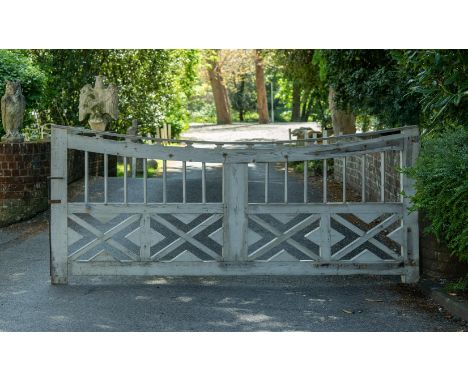 A LARGE WHITE PAINTED GARDEN GATE 20TH CENTURY 120cm high, 295cm wide, 5cm deep excluding iron brackets      Condition Report