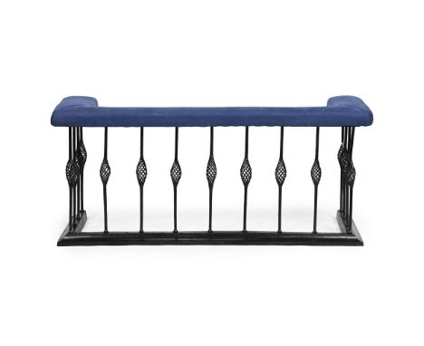 A WROUGHT IRON AND UPHOLSTERED FENDER SECOND HALF 20TH CENTURY externally 62cm high, 136cm wide, 52.5cm deep internally at th