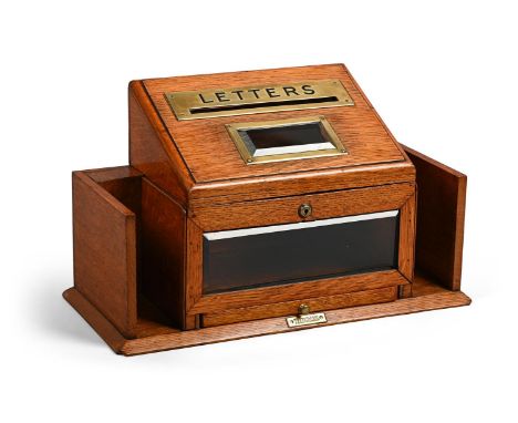A VICTORIAN OAK AND BRASS MOUNTED LETTER BOX LATE 19TH CENTURY With a frieze drawer above a brass plaque inscribed 'TELEGRAMS