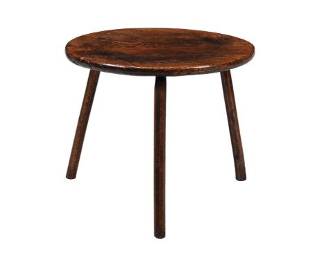 A GEORGE III OAK CRICKET TABLE  LATE 18TH CENTURY  50cm high, 61cm diameter Please note, the description has been updated and