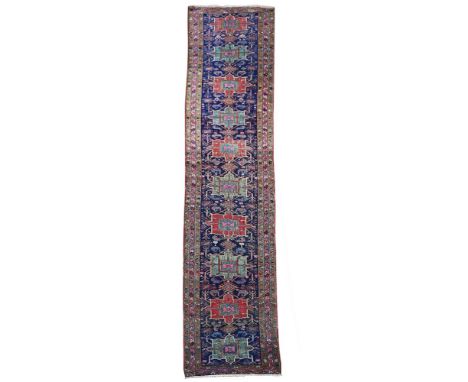 A HERIZ RUNNER approximately 550 x 110cm 