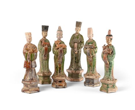 A GROUP OF SIX CHINESE SANCAI GLAZED FIGURES QING DYNASTY Each wearing a long robe with their hands clasped to the front hold