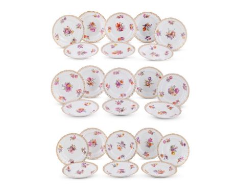 A SET OF TWENTY FOUR BERLIN (KPM) PORCELAIN NEUOZIER DINNER PLATES CIRCA 1891-1915 Each decorated in deutsche Blumen with gil
