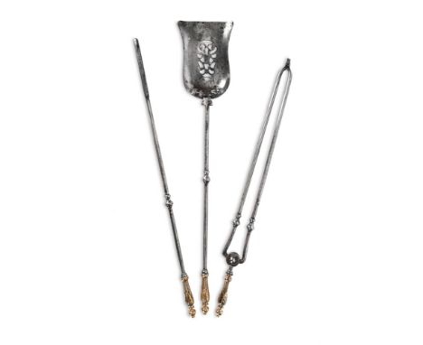A GEORGE III SET OF THREE BRASS HANDLED POLISHED STEEL FIRE TOOLS  CIRCA 1800  With floral twist handles  the shovel 76.5cm l