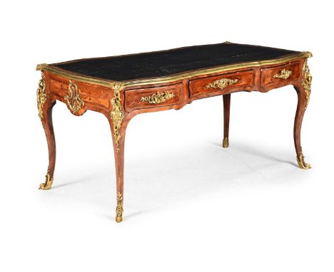 Y A LOUIS XV KINGWOOD, TULIPWOOD AND ORMOLU BUREAU PLAT MID 18TH CENTURY The ormolu corner mounts and handles with stylised d