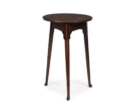 A GEORGE III OAK CRICKET TABLE THIRD QUARTER 18TH CENTURY 67cm high, the top 43.5cm diameter, the base 45cm wide