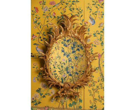 A LARGE CARVED GILTWOOD MIRROR IN THE MANNER OF JOHN LINNELL, 19TH CENTURY 138cm high, 95cm wide  This mirror previously sold
