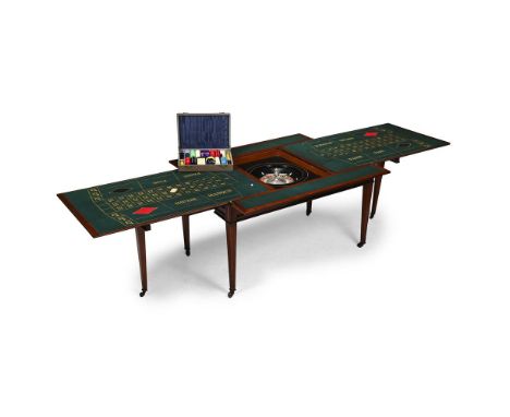 A WALNUT ROULETTE CENTRE TABLE  ATTRIBUTED TO MASON & CO, FIRST HALF 20TH CENTURY  The removable table top overlying two hing