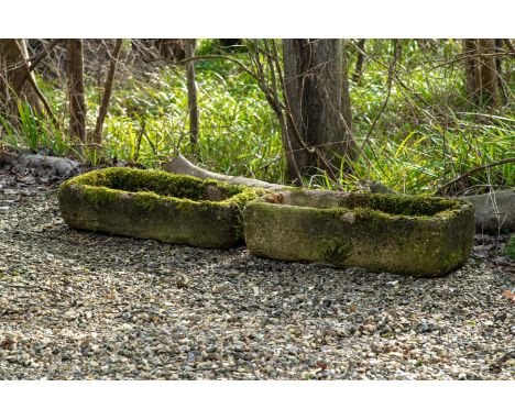 A GROUP OF FIVE STONE COMPOSITION AND STONE TROUGHS VARIOUS DATES AND SIZES the largest bowfront trough 27cm high, 69cm wide,