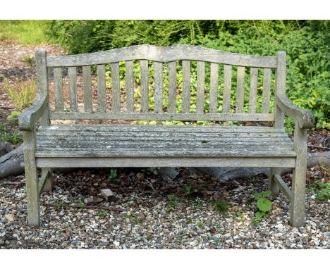 A TEAK GARDEN BENCH BY SLOANE & SONS, CONTEMPORARY With plaque for 'Sloane & Sons, Garden Benches|England|Est 1989'  97cm hig