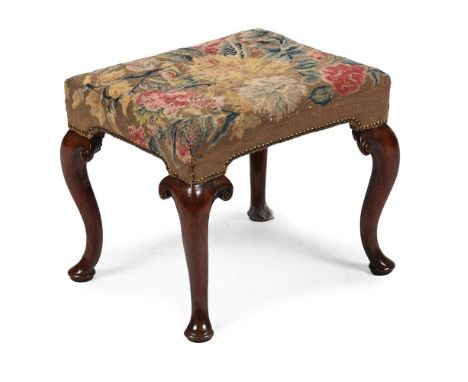 A GEORGE I WALNUT AND NEEDLEWORK STOOL CIRCA 1720 The rectangular padded seat upholstered with 18th century tapestry 41cm hig