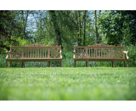A PAIR OF CARVED TEAK 'HAREWOOD' GARDEN BENCHES IN THE MANNER OF THOMAS CHIPPENDALE, CONTEMPORARY 102cm high, 223.5cm wide, 6