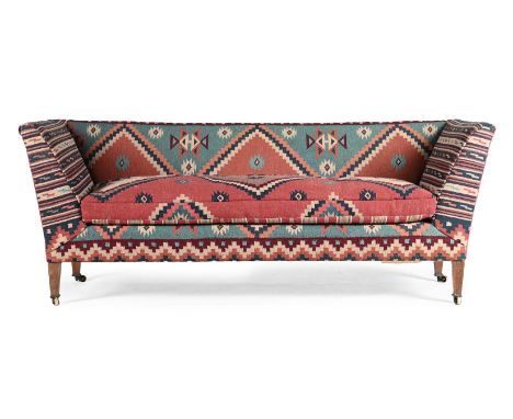 A WALNUT AND KILIM UPHOLSTERED SOFA IN THE MANNER OF HOWARD & SONS, LATE 19TH OR EARLY 20TH CENTURY 79cm high, 205cm wide, 77
