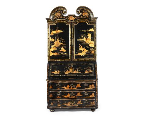 A CHINESE EXPORT BLACK AND GILT LACQUER BUREAU CABINET PROBABLY CANTON (GUANGZHOU), MID 18TH CENTURY The architectural pedime