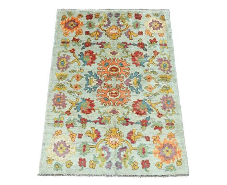 AN USHAK CARPET approximately 321 x 170cm