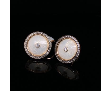 A PAIR OF 14ct YELLOW GOLD AND WHITE GUILLOCHE ENAMEL STONE SET CUFFLINKS.  WEIGHT 10.6grms. 