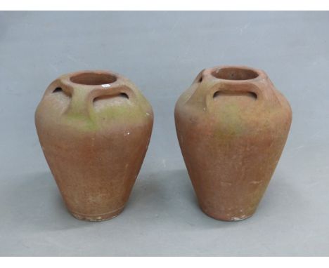 ATTRIBUTED TO THE COMPTON POTTERY, A PAIR OF TERRACOTTA OVOID VASES, EACH WITH FOUR HANDLES JOINING THE RIMS OF THE SHOULDERS
