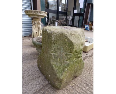 AN ANTIQUE CARVED STONE ELEMENT, A LARGE ANTIQUE STONE COLUMN SUPPORT, A LATER THREE GRACES BIRD BATH AND A PLANTER.