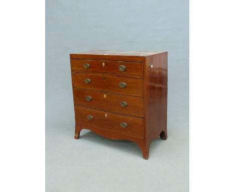 A GEORGE III MAHOGANY CHEST, THE FOUR GRADED DRAWERS INLAID WITH CHEVRON BANDS, THE APRON CURVING INTO THE BRACKET FEET.   W 