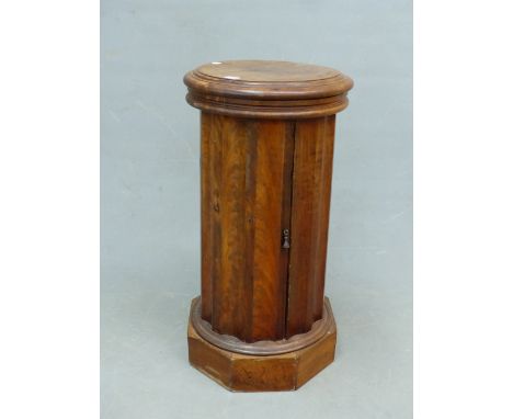 A WALNUT VICTORIAN FLUTED COLUMNAR BEDSIDE TABLE A WASH BASIN WITHIN THE LIFT UP TOP, THE SIDE DOOR OPENING ONTO A SHELF.   D