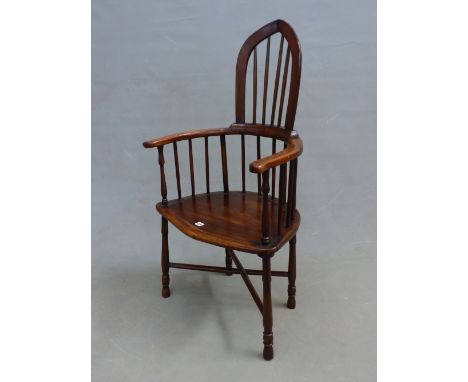 AN INTERESTING RUSTIC COMB BACK ARMCHAIR, SHAPED SEAT,  TURNED LEGS JOINED BY CROSS STRETCHER.