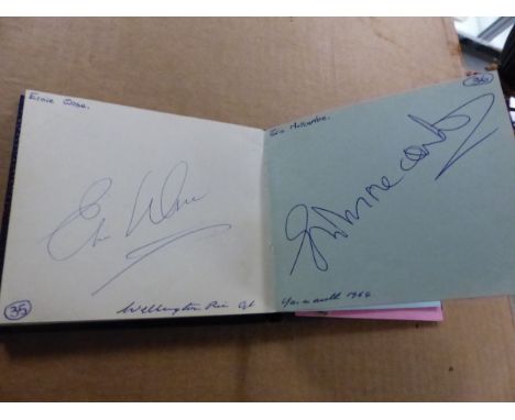 A 1960'S AUTOGRAPH BOOK INCLUDING SIGNATURES OF FOOTBALLERS, THE SHADOWS, DES O'CONNOR, MORECOMBE AND WISE, RUBY MURRAY AND O