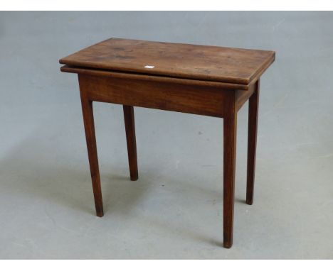 A GEORGE III MAHOGANY TEA TABLE, THE RECTANGULAR TOP OPENING ON A SINGLE GATE AND ON CHAMFERED SQUARE SECTIONED LEGS.   W. 75