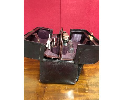 A GREAVES LEATHER GLADSTONE BAG FITTED WITH LATE VICTORIAN LEATHER AND SILVER MOUNTED FITTINGS TOGETHER WITH A PINK ENAMEL BA