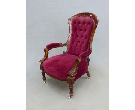 A VICTORIAN MAHOGANY SHOW FRAME ARMCHAIR, THE BACK BUTTON UPHOLSTERED IN WINE RED VELVET