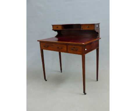 A LATE 19th C. LEATHER INSET MAHOGANY WRITING TABLE, THE SHELVES OF THE RECESSED BACK FLANKED BY TWO CROSS BANDED DRAWERS, TW