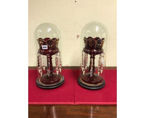 A PAIR OF LATE 19th C. BOHEMIAN ENAMELLED RUBY GLASS LUSTRES UNDER DOMES.   H 43cms.
