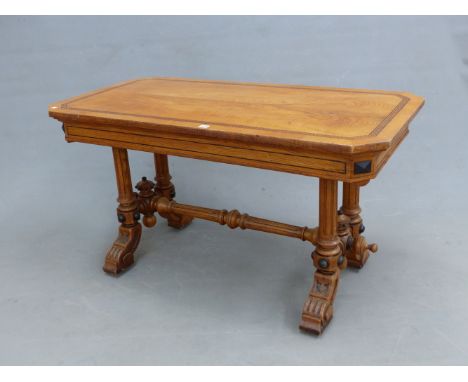 A GOTHIC REVIVAL  BULLOCK STYLE OAK TABLE WITH AN EBONY KEY FRET BAND TO THE CANTED RECTANGULAR TOP SUPPORTED ON PAIRS OF FLU