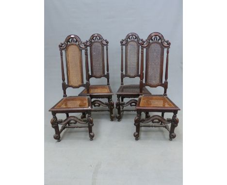 A SET OF FOUR CHARLES II STYLE OAK CHAIRS, THE BACKS CANED BETWEEN GUN BARREL COLUMNS, THE CANED SEATS ON BRACKET FRONT LEGS 