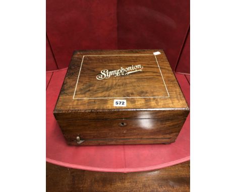 A ROSEWOOD CASED SYMPHONION WITH METAL DISCS PLAYING ON A 10.5cms. COMB, THE DISCS.   Dia. 25.5cms. THE CASE.   W 33 x D 29.5