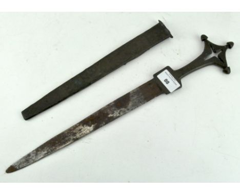 An unusual early dagger with three point brass handle, the sheath with hammered foliate decoration, 44.5cm long 