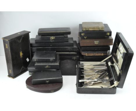 A large collection of vintage cutlery boxes, including a carving set