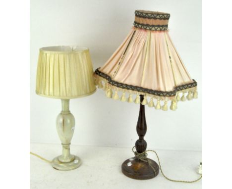 A turned mahogany table lamp together with an alabaster example, both with shades, largest 44cm high excluding shade