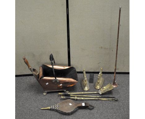 Assorted brassware, including fire irons, fire side tools, fire dogs, a coal basket and more