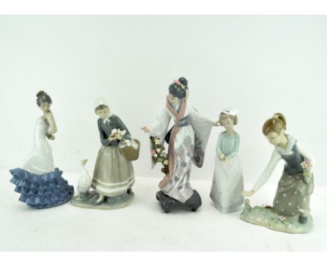 A group of five Lladro and Nao figures, the largest being 28cm high