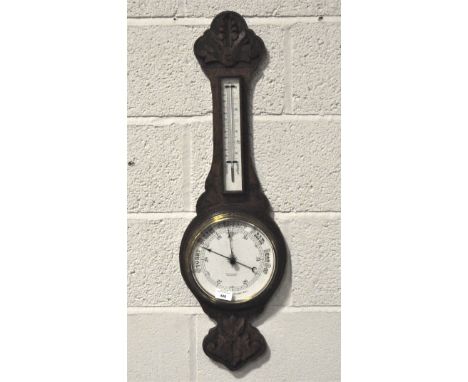 An Edwardian oak aneroid barometer by H R Phillips, 83cm long