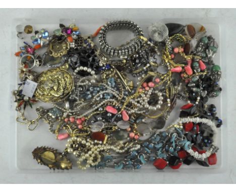 A selection of vintage costume jewellery, necklaces brooches and more