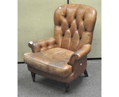 A leather button back armchair, 102cm high