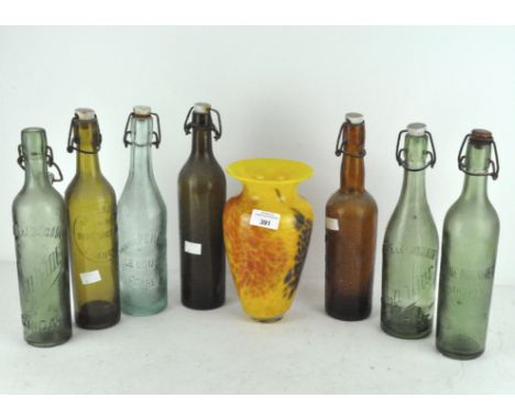 A selection of various vintage glass bottles, including Biere and Limonade, some being coloured glass, together with an art g