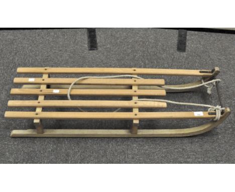 A vintage Davos Flyer toboggan, produced by Grays of Cambridge, 98cm long
